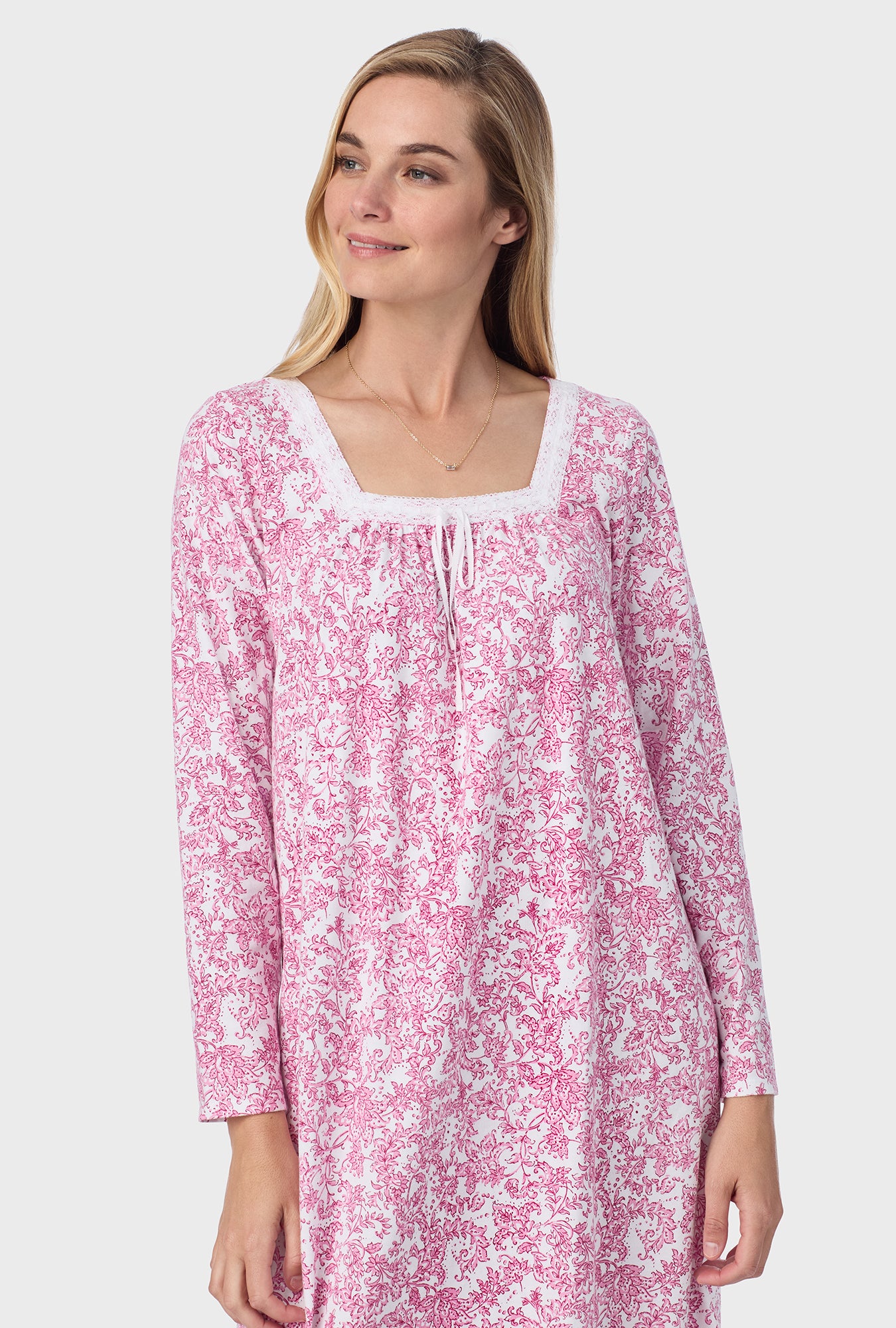 A lady wearing ballet nightgown with berry paisley print