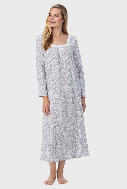 A lady wearing ballet nightgown with grey paisley print