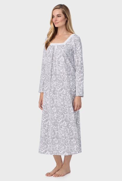 A lady wearing ballet nightgown with grey paisley print