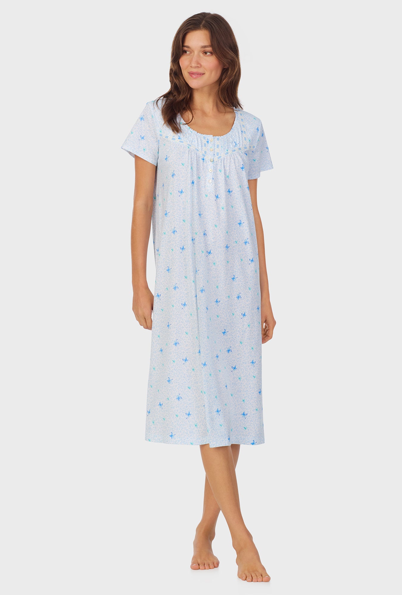 A lady wearing Blue Hummingbird Cotton Waltz Nightgown