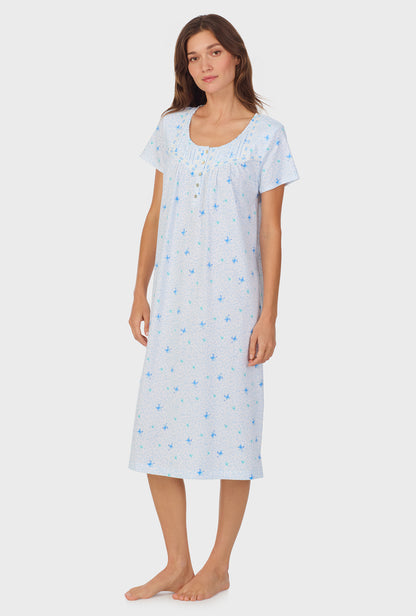 A lady wearing Blue Hummingbird Cotton Waltz Nightgown