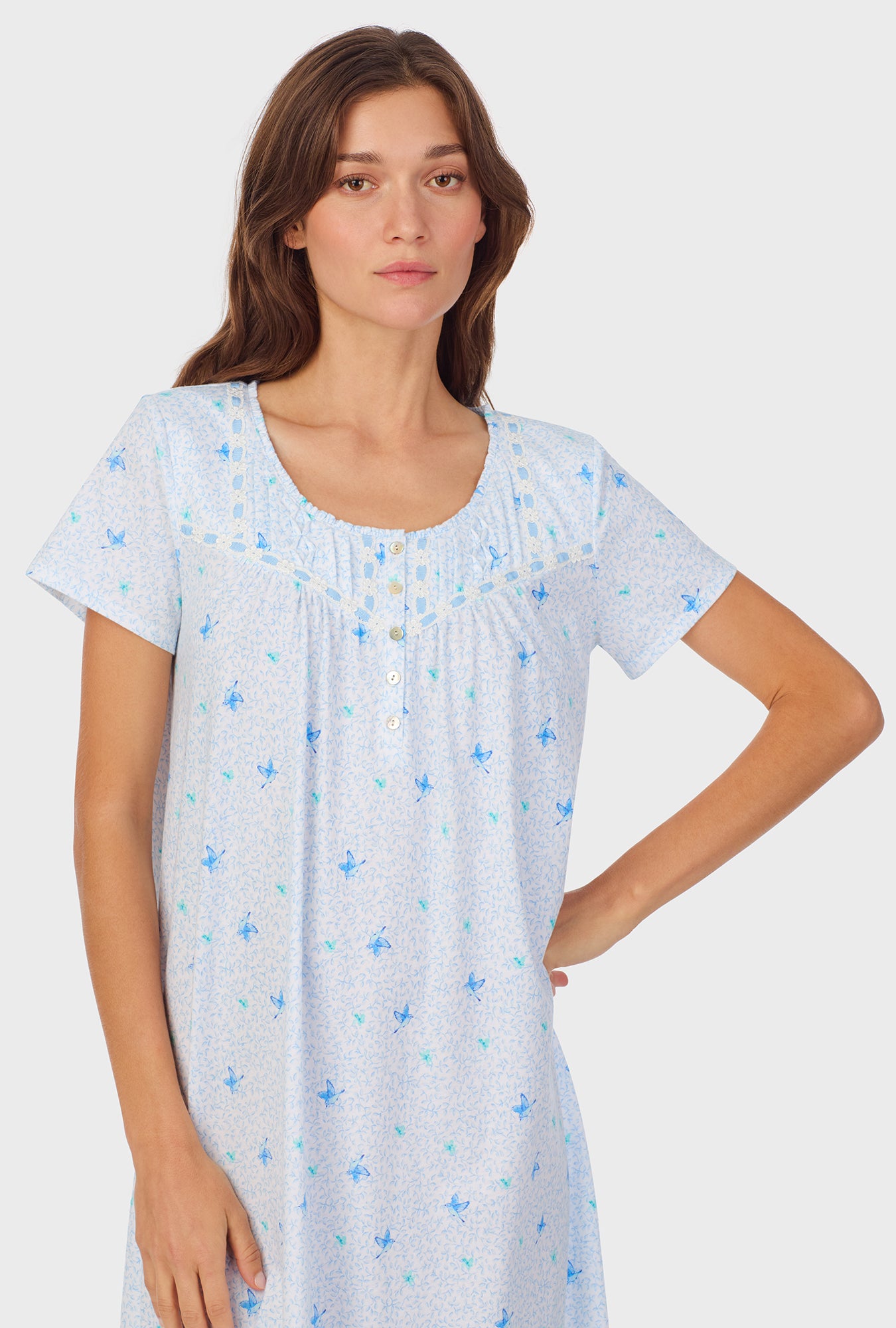 A lady wearing Blue Hummingbird Cotton Waltz Nightgown