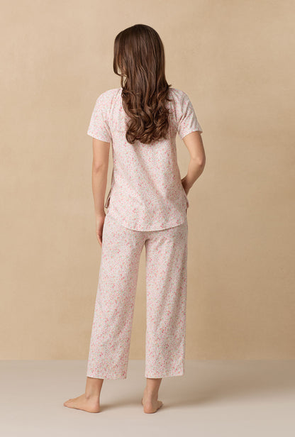 A lady wearing Meadow Floral Capri Cotton Knit Pajama Set