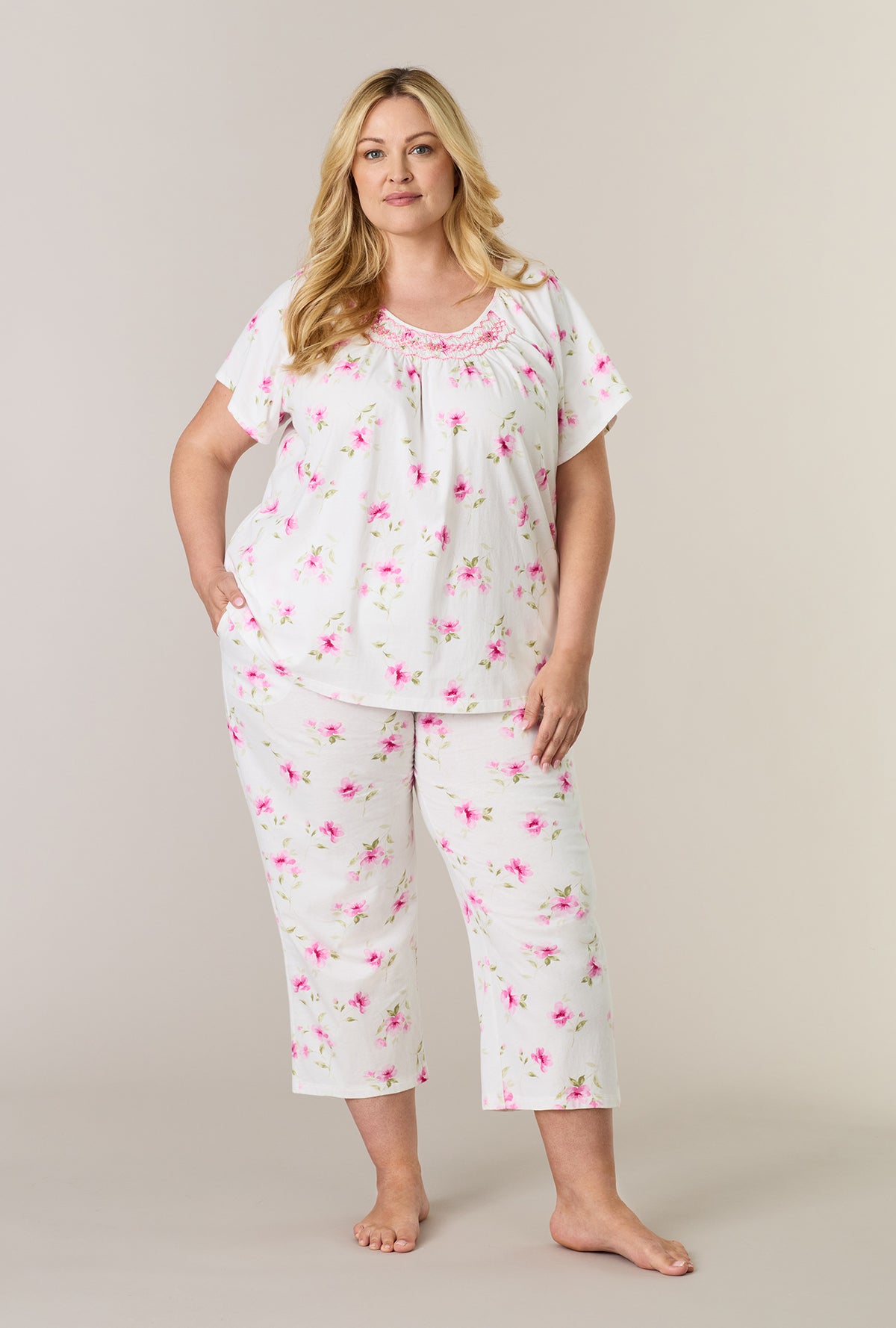 A lady wearing plus size Blush Garden Cotton Capri Pajama Set