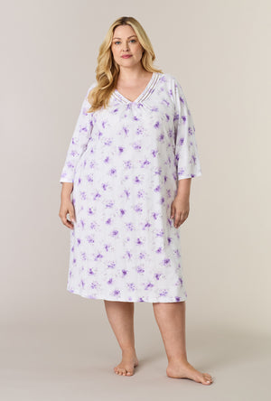 A lady wearing plus size Lilac Blooms Cotton Midi Nightgown