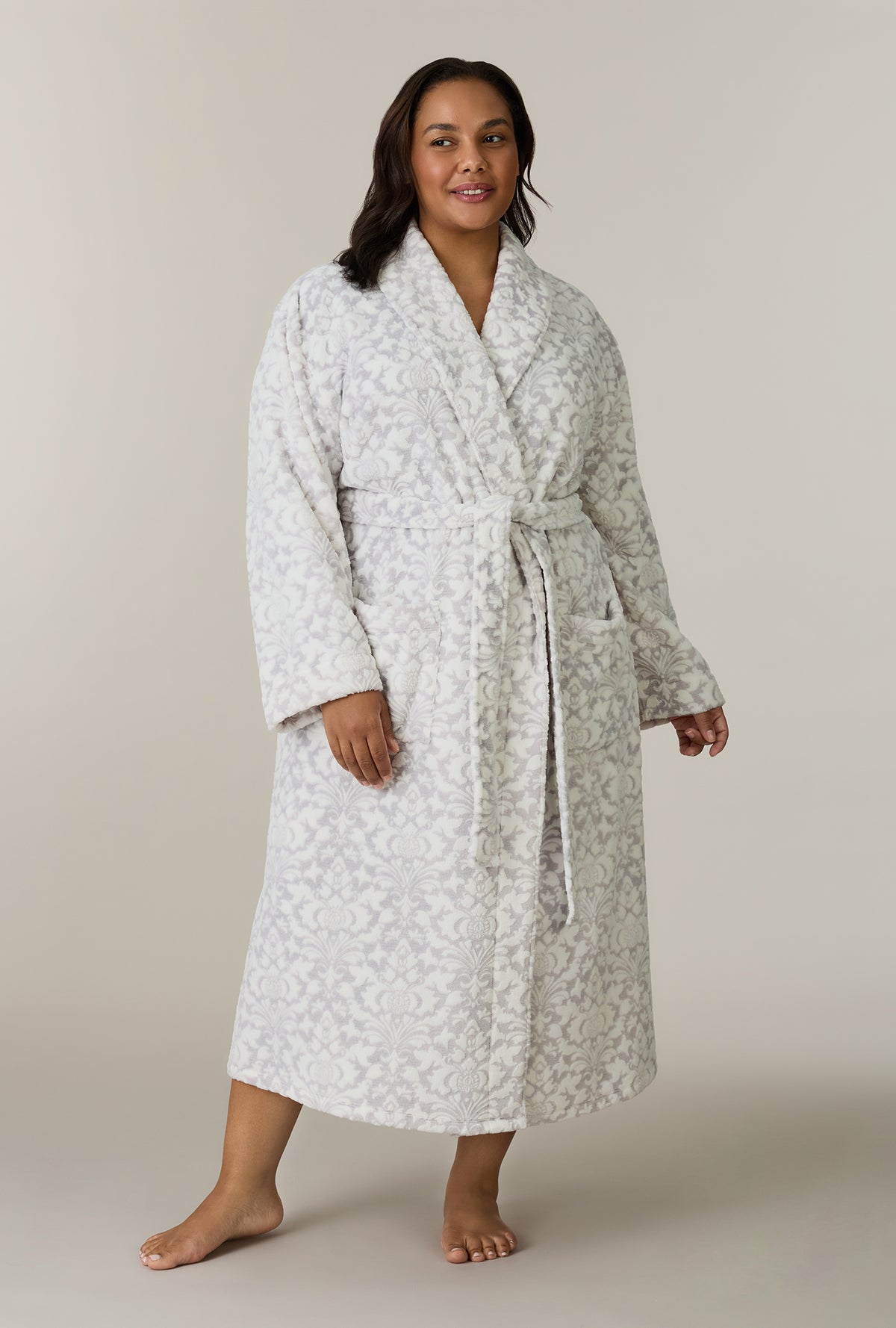 A lady wearing plus size Pearl Damask Wrap Two-Tone Velour Ballet Robe