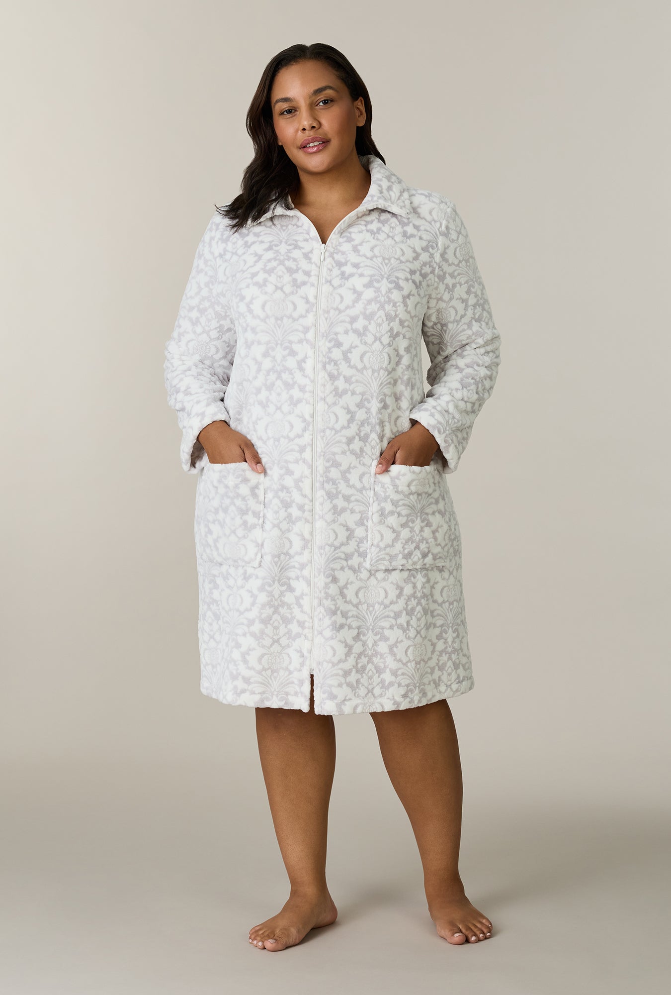 A lady wearing plus size Pearl Damask Two-Tone Velour Short Zip Robe