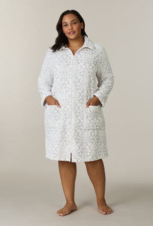 A lady wearing plus size Pearl Damask Two-Tone Velour Short Zip Robe