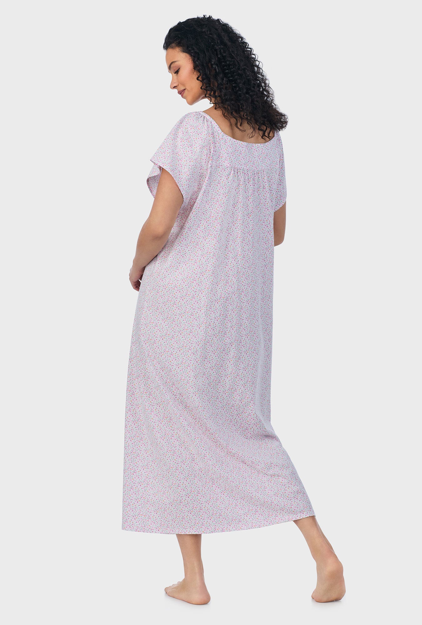 A lady wearing pink short sleeve cotton ballet plus size nightgown with tulip field print.