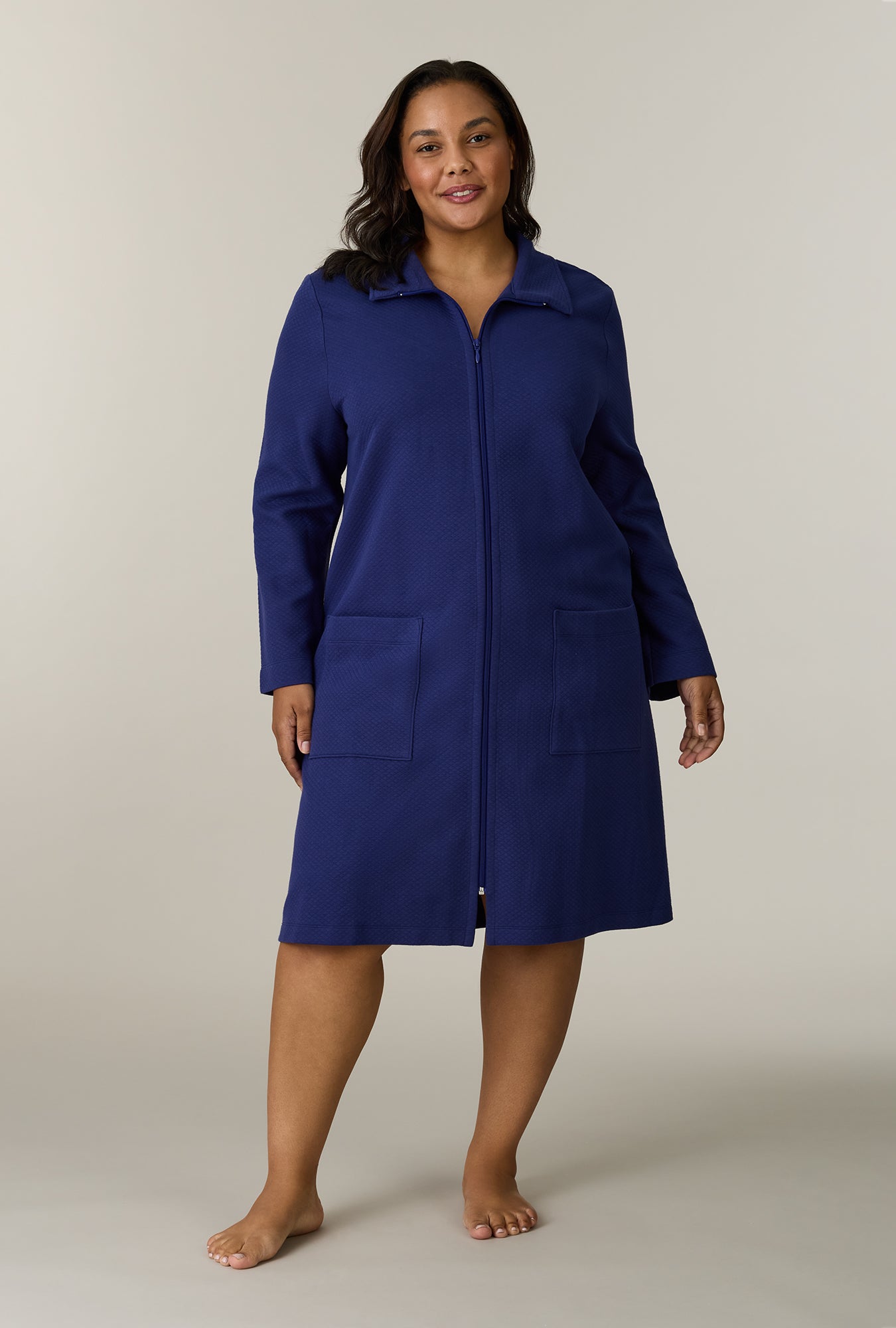 A lady wearing Midnight Navy Cotton Diamond Quilted Zip Robe looking front