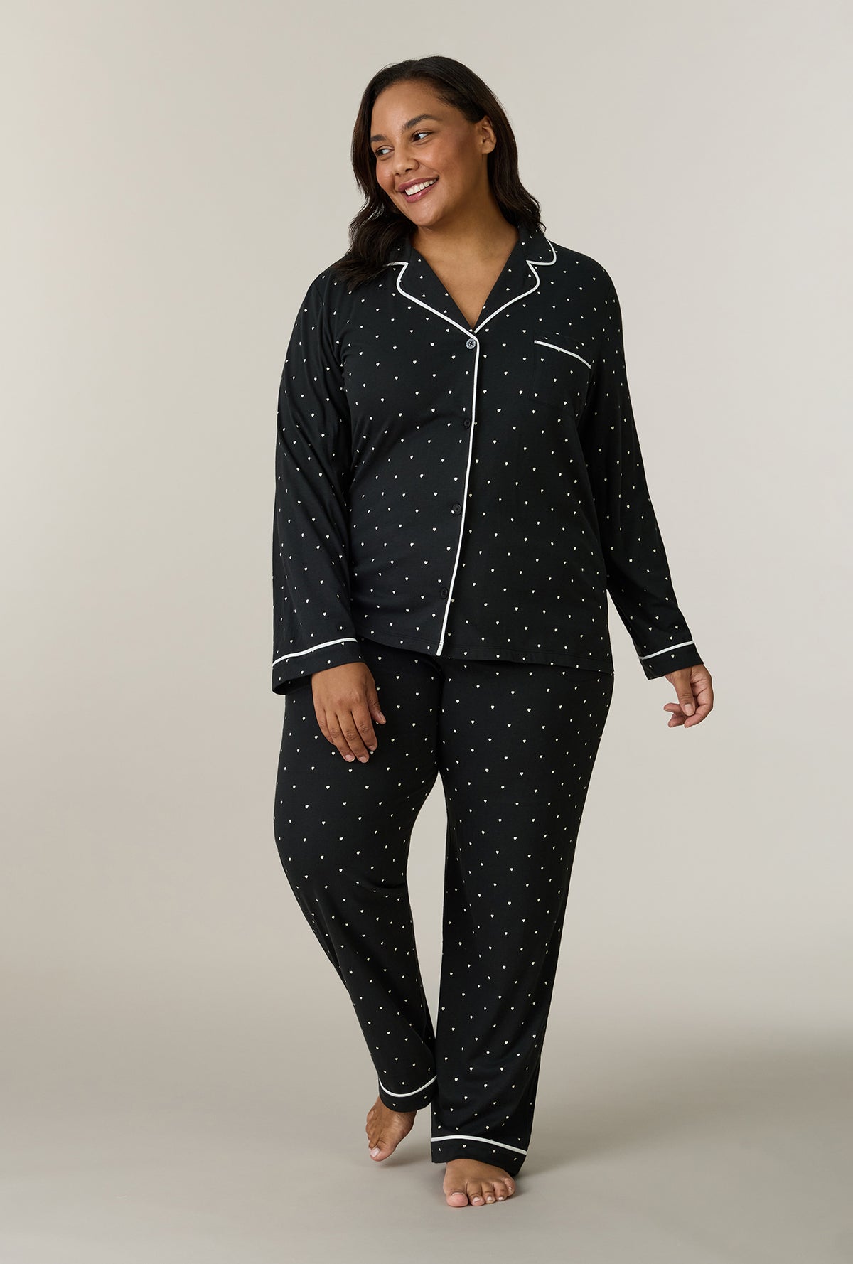 A lady wearing plus size Midnight Hearts Cotton Notch Collar Long Pajama Set