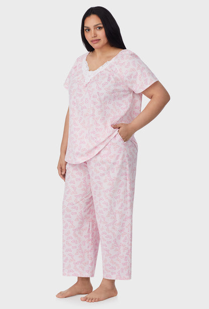 A lady wearing Pink Butterfly Cotton Capri plus Pajama Set