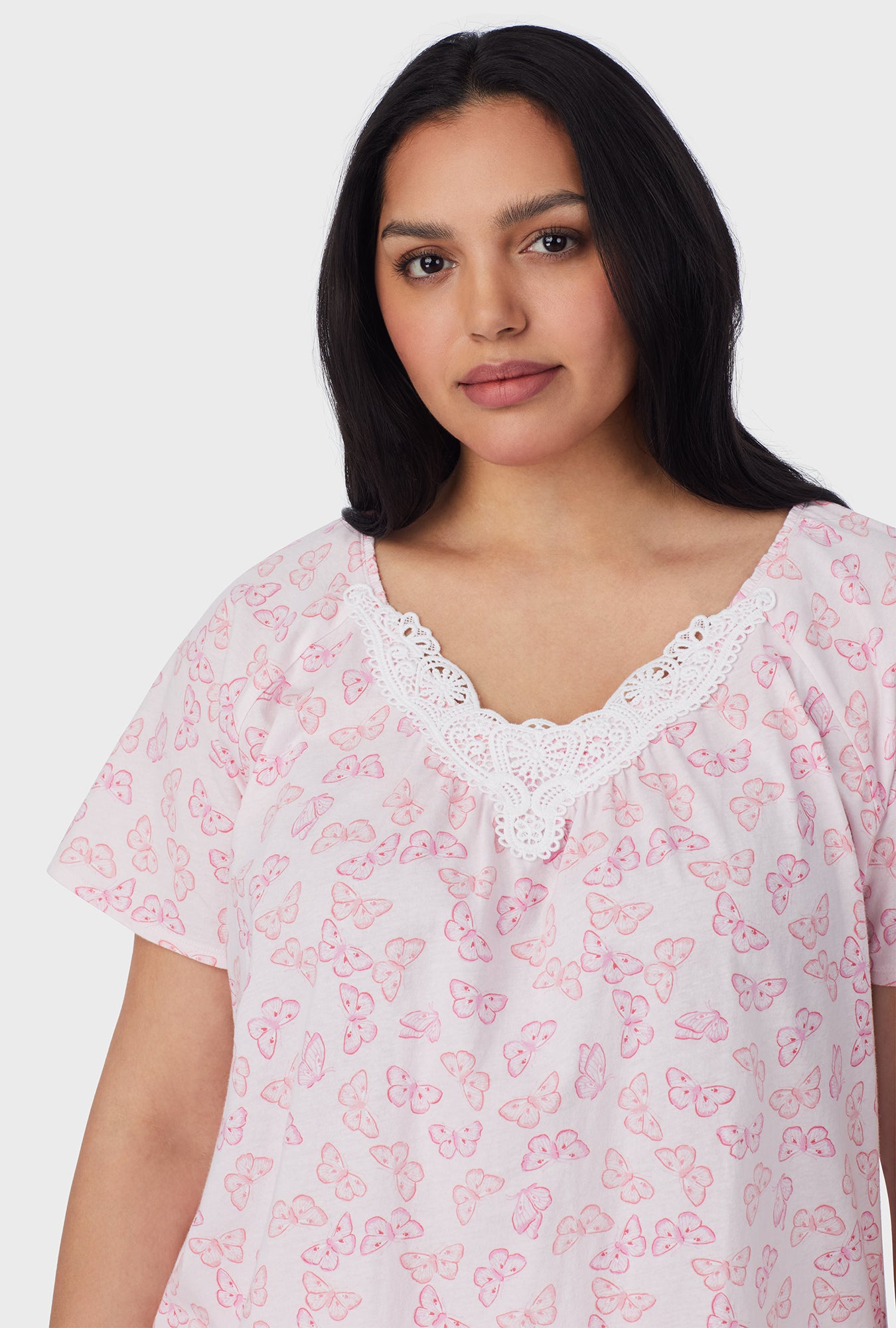 A lady wearing Pink Butterfly Cotton Capri plus Pajama Set