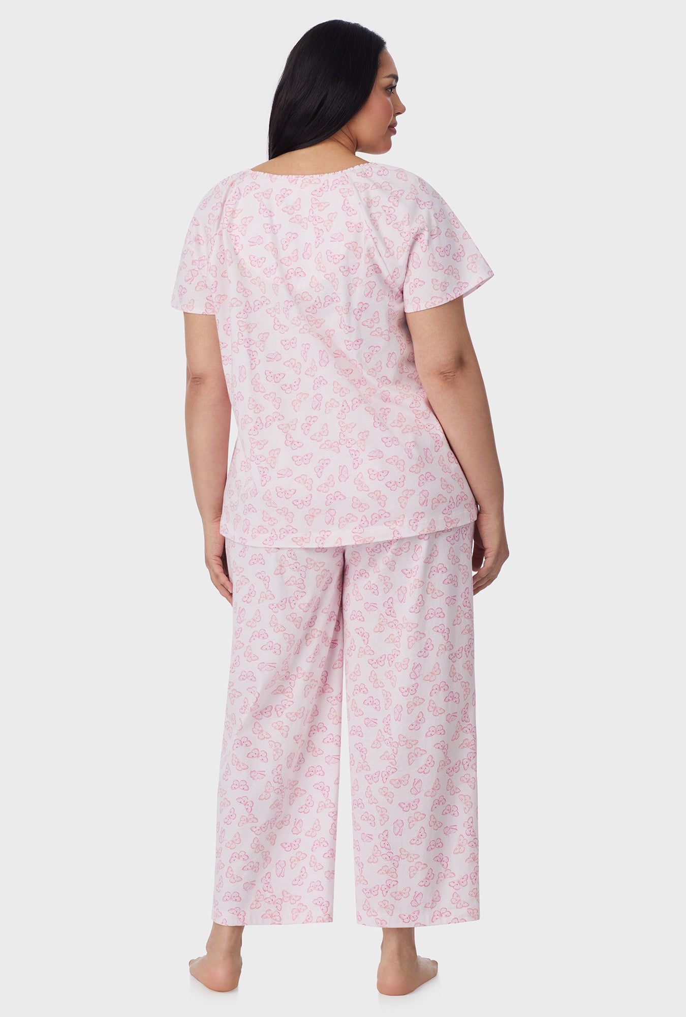 A lady wearing Pink Butterfly Cotton Capri plus Pajama Set