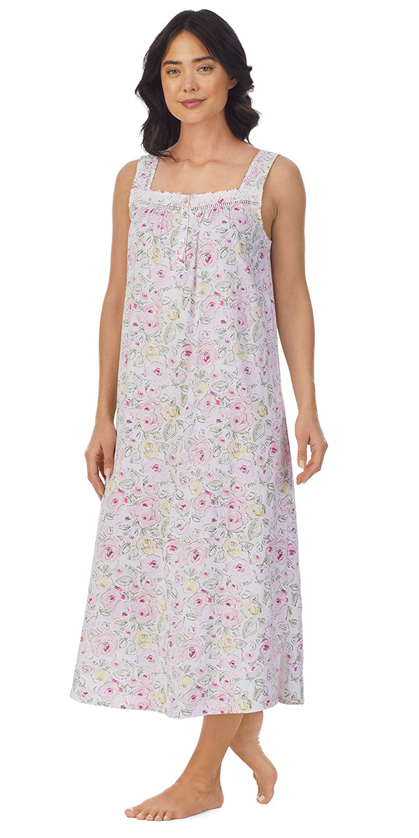 A lady wearing a sleeveless long nightgown with sketchy roses pattern.